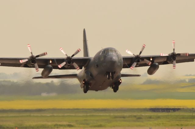 Lockheed C-130 Hercules — - RCAF Lockheed C130 Hercules on departure from a visit to Yorkton with blooming canola fields in the background. 