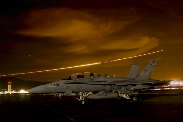 — — - "VX-9 "VAMPIRES" F/A-18 HORNET ON RAMP AT BUR WITH SOUTHWEST 737 LEAVING LIGHT TRAIL BEHIND"