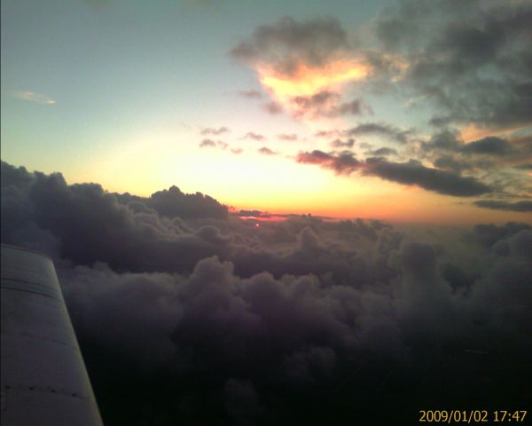 N5187L — - New Years Day sunset climbing out of Albert Whitted