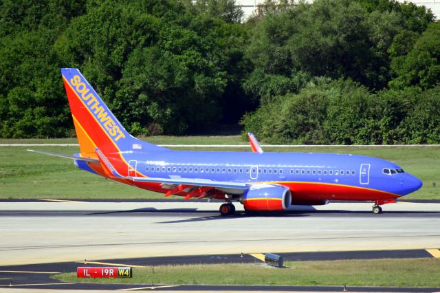 BOEING 737-300 (N969WN) - Southwest Flight 2088 (N969WN) arrives on Runway 1L at Tampa International Airport following a flight from Chicago-Midway International Airport