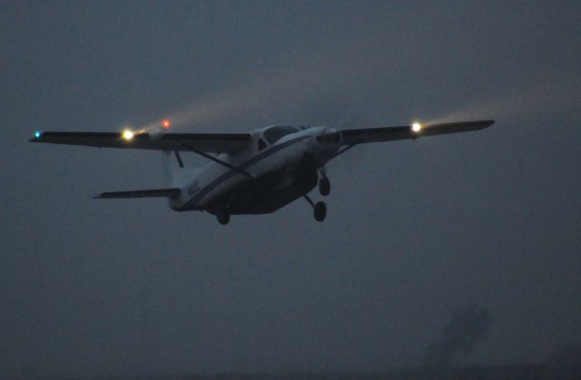 Cessna Caravan (BXR1571) - "Boxer" 1571 departs Merced Regional Airport in a thick Thule fog.