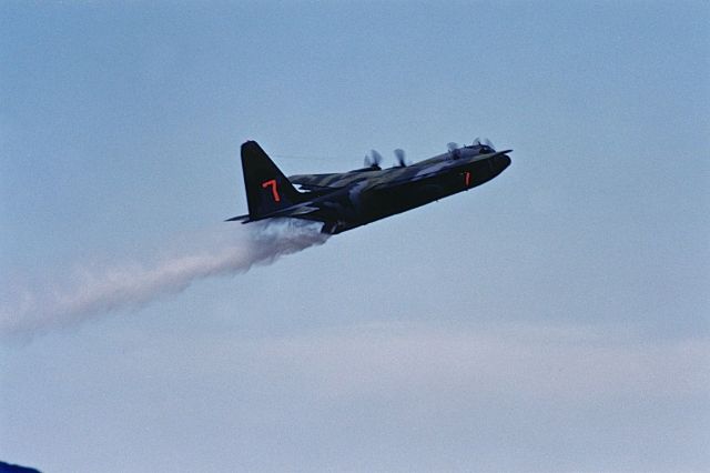 Lockheed C-130 Hercules — - C-130 climbing out after water drop demonstration at the Air Power Air Show in KOKC