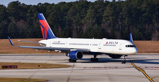 Boeing 757-200 (N707TW) - N707TW making the turn off of 5L, arriving from CDG. At the RDU observation deck, 12/3/17.