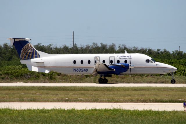 Beechcraft 1900 (N69549) - Touching down on R09 at the end of flight GFT9191 from TPA on 29-Jul-10.