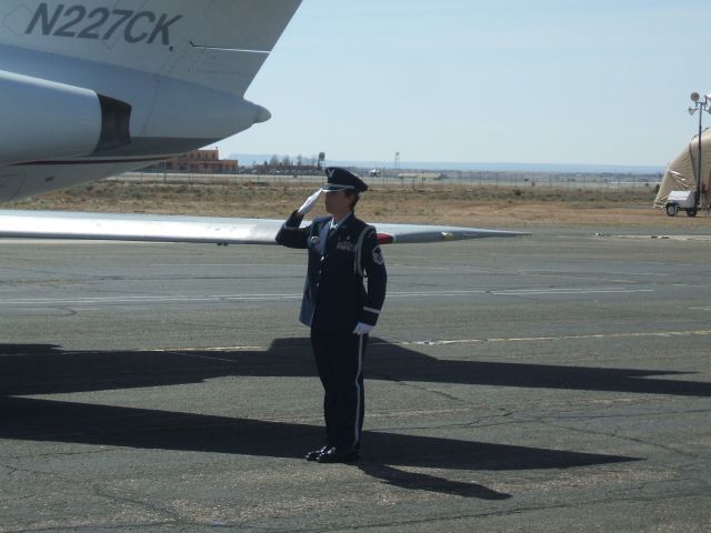 Dassault Falcon 20 (N227CK) - USAF Honor Guard NCOIC salutes as fallen hero is taken to funeral coach