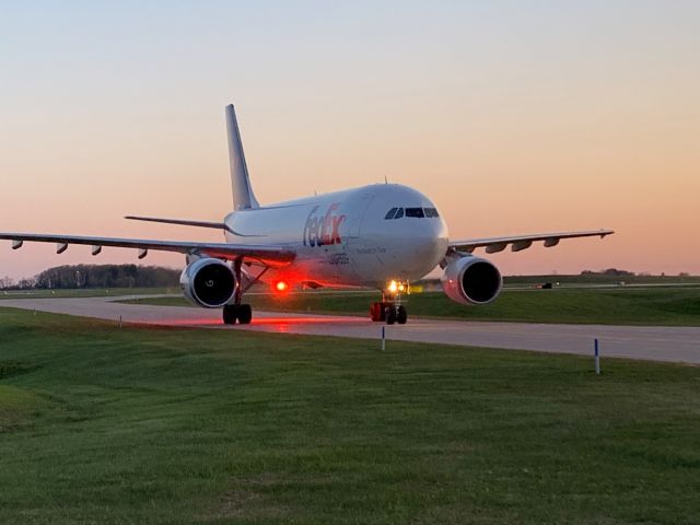 Airbus A300F4-600 (N673FE) - FDX Flight 325 from Fargo arriving at ATW and taxiing to Gate 1 at 5 minutes past sunset. 