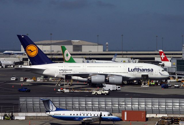 Airbus A380-800 (D-AIMD) - May 10th, 2011- Tram view of the Inaugural A380 passenger service from SFO-FRA. This is the north concourse, Intl dock, gate 101. They used 3 air-bridges loading passengers for this flight.