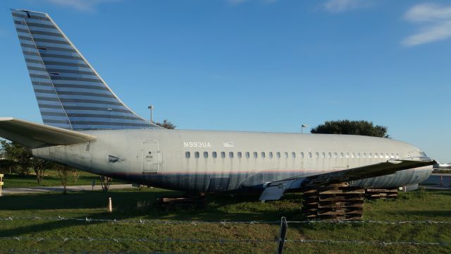 Boeing 737-200 (N993UA) - Up on timbers by fire station.