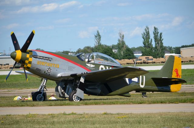 — — - EAA 2011 P-51D Gunfighter just hanging out doing what P-51s do without effort - looking good!