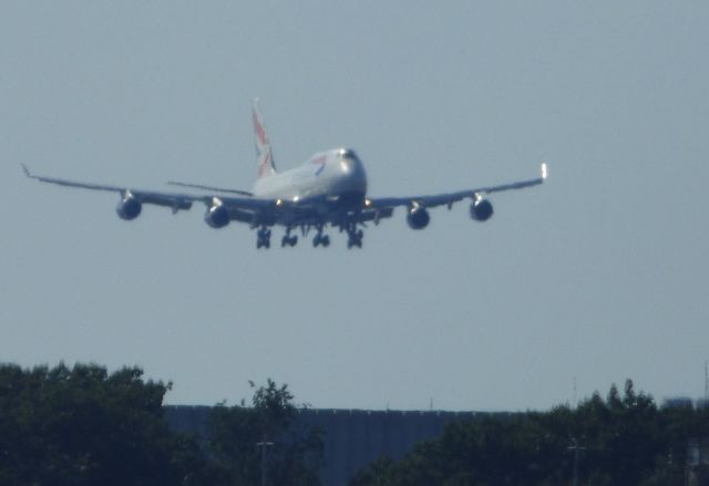 Boeing 747-400 (G-BYGG) - Shown here a moment away from landing is a British Airways Boeing 747-400 about to complete its daily flight from London in the Autumn of 2017. On max zoom and standing in a different state across a river so it is what it is.  Even at this distance it is a big plane.  I posted 29 other planes and this 747 is taking off with all sorts of views and votes. Thanks for the attentions everyone on my jumbo shot.  This shot is so poor Im using it as my desktop screen saver. br /If you take the time to view this please vote.