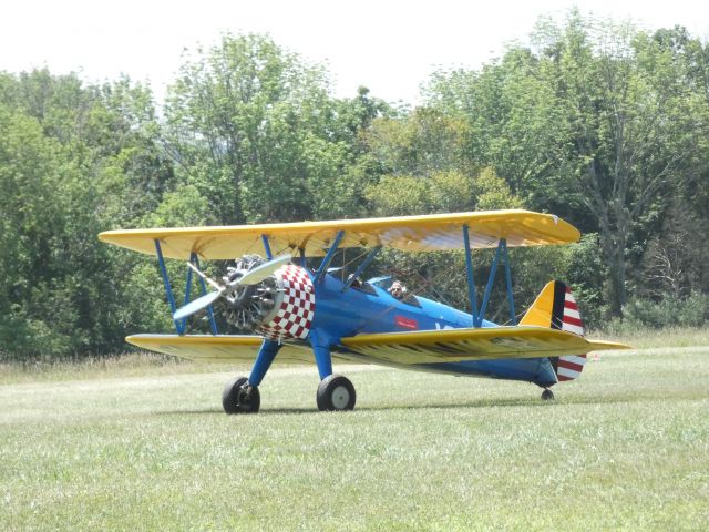 Boeing PT-17 Kaydet — - A registration number on this aircraft was nowhere to be seen so I am assumning it is a Boeing Stearman Model 75 Kaydet taxiing on the grassy airstrip in the Summer of 2020. Not in view is a large white number 16 on each side of the livery.