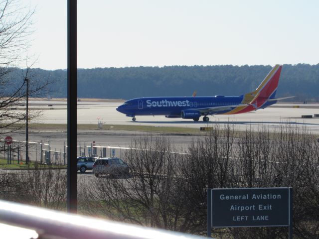 Boeing 737-800 (N8662F) - Southwest flight 3801 from Chicago Midway Intl, a Boeing 737-800 taxiing to the gate about to cross to the other side of the airport after landing on runway 23R. This was taken January 30, 2016 at 3:47 PM.