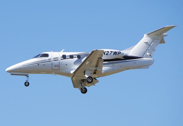 Embraer Phenom 100 (N27WP) - Embraer private jet on final for 25