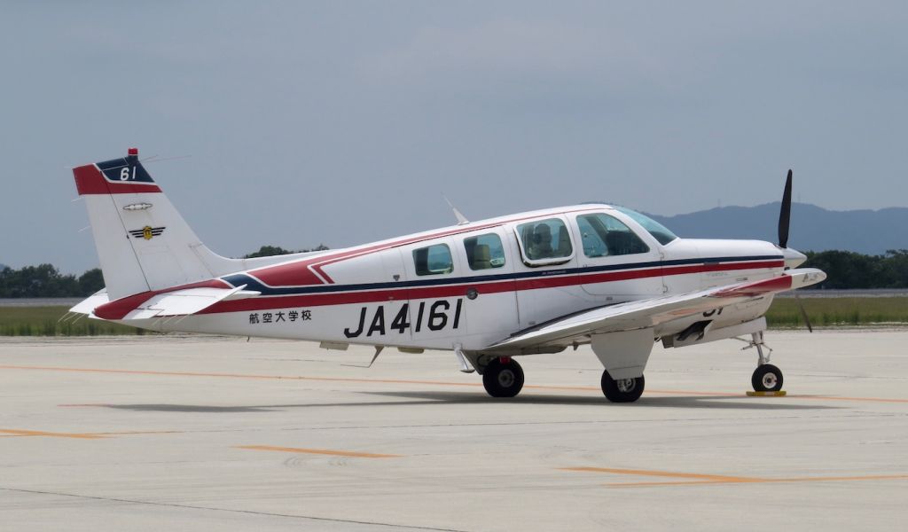 Beechcraft Bonanza (36) (JA4161) - Beech Bonanza of the Civil Aviation College located in Miyazaki on a training flight parked in front of the Hiroshima Airport FBO