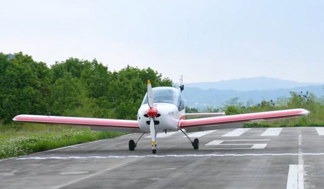 — — - This is a young man in China who wants to compete with a car and a plane.