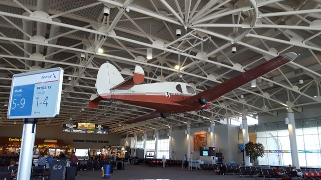 Mooney M-20 (N1KQ) - This interesting airplane is hanging in the D Concourse of the Charlotte Douglas International Airport.