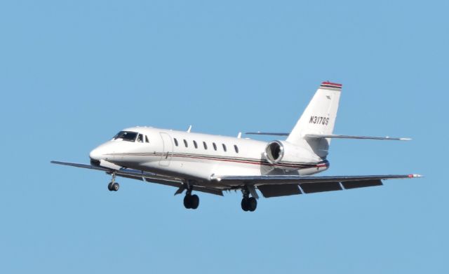 Cessna Citation Sovereign (N317QS) - Shown here a moment or two from landing is this Citation Soverign in the Winter of 2016.