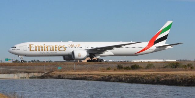 BOEING 777-300ER (A6-EQC) - A massive 777 about to cross the Juliet bridge at MCO after a very long flight from DXB- I bet those passengers are glad to be home.