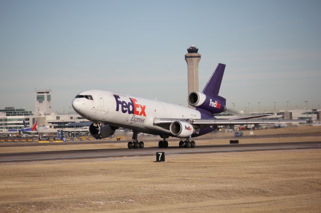 McDonnell Douglas DC-10 (N321FE) - Taking off on 17R at DIA full of Christmas goodies.