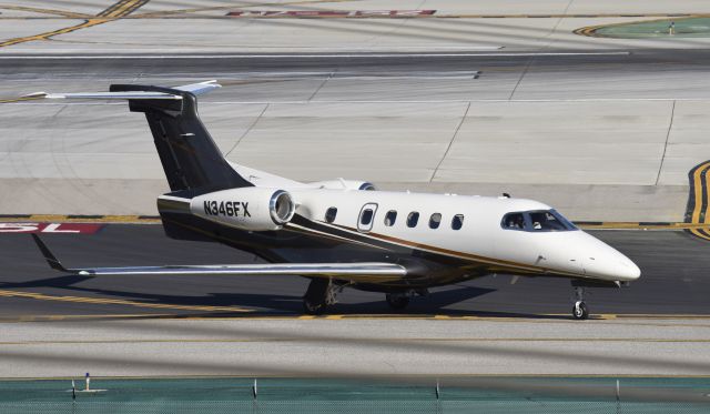 Embraer Phenom 300 (N346FX) - Taxiing to parking at LAX