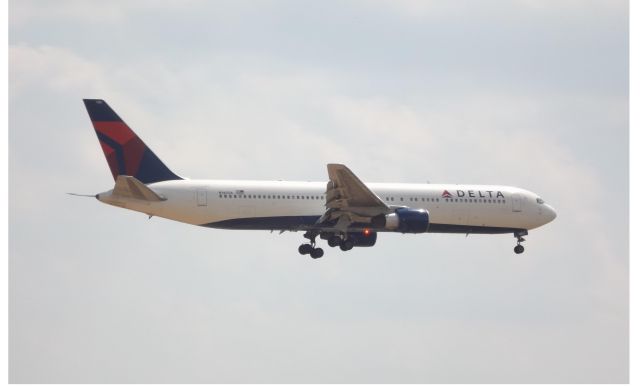 BOEING 767-300 (N1402A) - From the 9th floor balcony at the Best Western Plus on Central Ave.