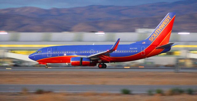 Boeing 737-700 (N207WN) - Landing Rollout, Engines in reverse on 30L, was still going fast for were it was on the runway .. about 3/4 of 11,000 behind it