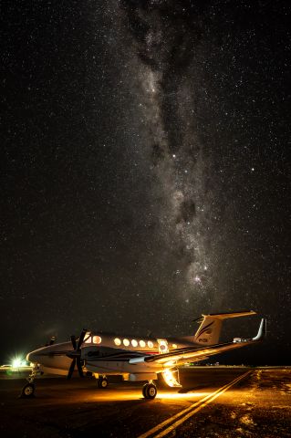 Beechcraft Super King Air 200 (VH-ZOK) - Waiting under the stars at Birdsville, Queensland.