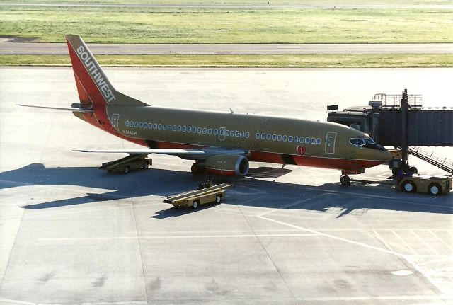 Boeing 737-700 (N344SW) - Parked at gate, Terminal A. Shot in 1994.