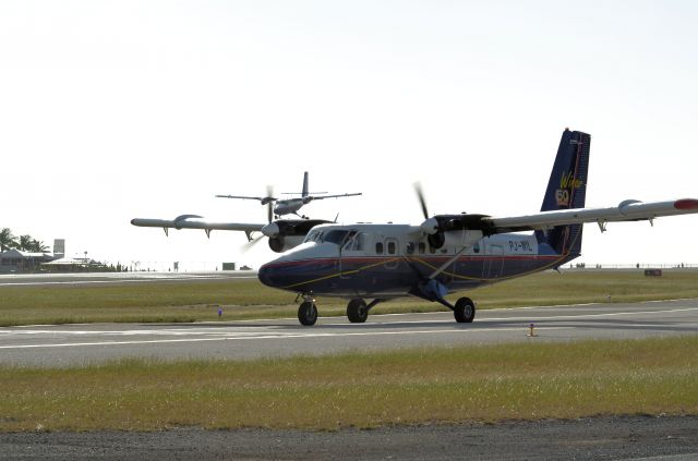 De Havilland Canada Twin Otter (PJ-WIL) - Winair landing and Winair lined up