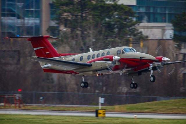 Beechcraft Super King Air 200 (N700NA) - I thought this was a fantastic shot of this 1994 Beech B200 Super King Air. It had just taken off from Atlanta's PDK executive airport. The lens I was using was a Canon 500mm F4 IS with a 2x extender, thereby effectively making it a 1000mm lens. In order to show motion on the propellers, I had to slow the shutter all the way down to 1/250. With a 1000mm focal length and a slow shutter, the odds on getting a clear image were pretty slim. Thankfully everything worked out perfectly and I got THE shot. I was using a Canon 5DSR body and the settings were 1/250 shutter, F8, ISO 250. Please check out my other aviation photography. Votes and positive comments are always appreciated. Questions about this photo can be sent to Info@FlewShots.com