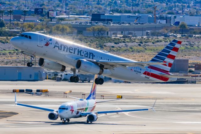 Airbus A320 (N658AW) - An American Airlines A320 taking off from PHX on 2/12/23 during the Super Bowl rush. Taken with a Canon R7 and Canon EF 100-400 II L lens.