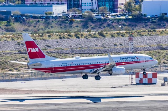 Boeing 737-800 (N915NN) - An American Airlines 737-800 in TWA retro livery landing at PHX on 2/28/23. Taken with a Canon R7 and Canon EF 100-400 L ii lens.