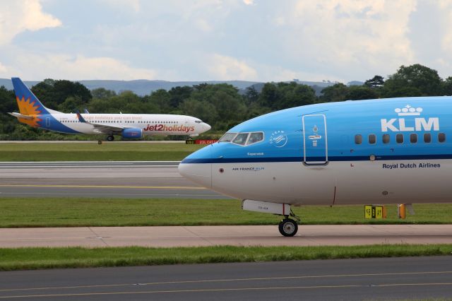 Boeing 737-800 (PH-BCD) - KLM from Amsterdam just vacated runway 23L while jet2holidays is ready to go