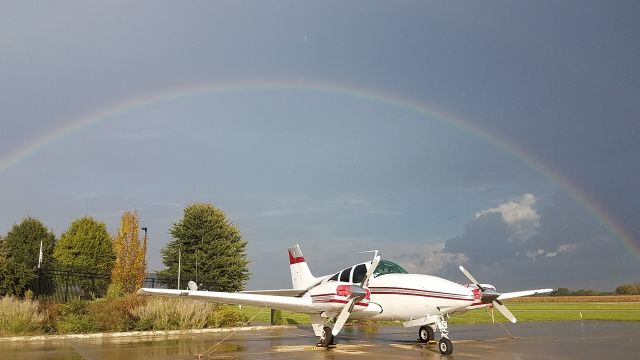 Beechcraft 55 Baron (N535Q) - Landed right before the storm came in and the rainbow came out