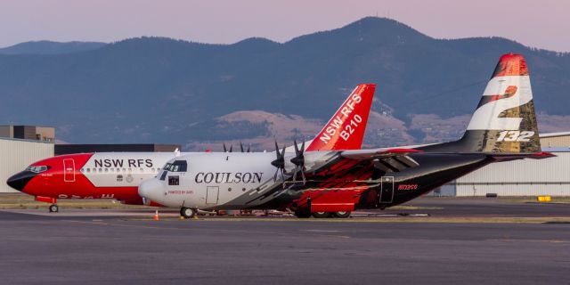 Lockheed C-130 Hercules (N132CG) - Coulson Tanker 132 resting along side Coulson/New South Wales Rural Fire Service Tanker B210 in September