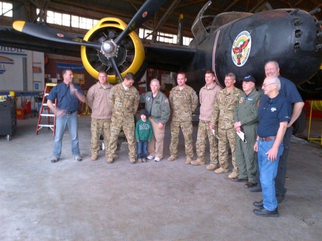 — — - CV-22 crew members from the 8Th SOS stopped by to meet the CAF A26 Invader. Little man was presented a set of wings by the Capt looking down at him. Thats Joe Maynard in green flight suit, based out of NKP back in the day.  Joe was Aircraft Commander in A26-K with 105 missions over the HCM trail