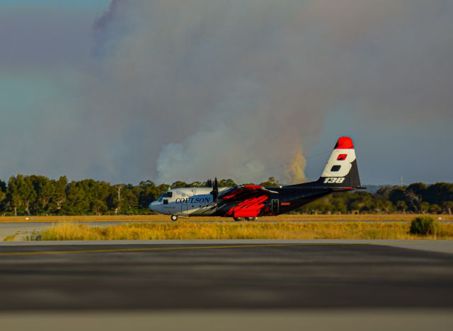 Lockheed C-130 Hercules (BMBR138) - Bomber 138. In the background is a bushfire 10 kilometres from where the photo was taken.