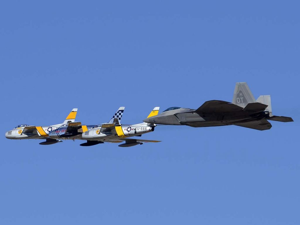 Lockheed F-22 Raptor (04-4068) - A Raptor flies in formation with three Sabres at the Air Force Heritage Conference.