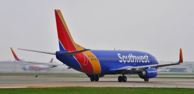 BOEING 737-300 (N655WN) - Waiting on Lone Star One to clear the runway