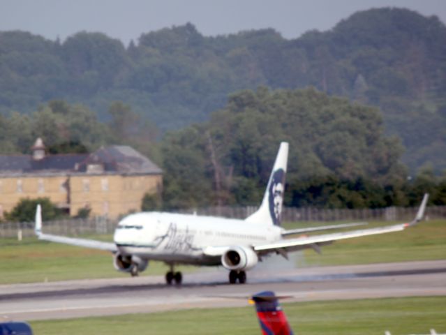 Boeing 737-800 (N552AS) - Touching down on 30R at MSP on 07/31/2011