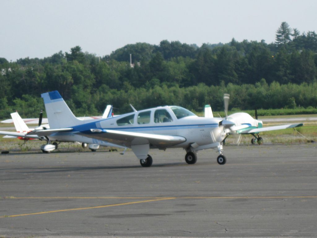 Beechcraft Bonanza (33) (N4505S) - Taxiing to runway 20 for a departure to Bedford, MA. (KBED).