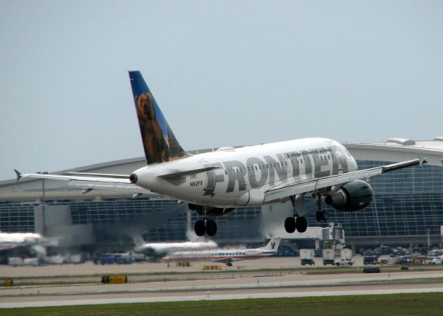 Airbus A318 (N812FR) - Landing on 18R at DFW. Rainy, overcast day in Dallas!