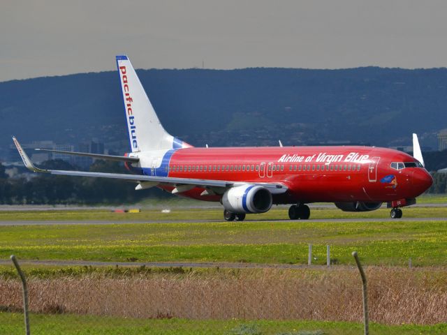 Boeing 737-800 (VH-VOX) - On taxi-way heading for take off on runway 05. Thursday 12th July 2012.