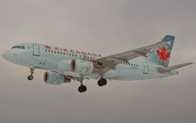 Airbus A319 (C-FYIY) - Against a winter grey sky The Maple Leaf still glows on FlightAware.Com !