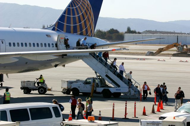 BOEING 757-300 (N57855) - KSJC - Oct 2006 - the 1st ever 757-3 into SJC - cut rate airport provides air stairs instead of nice jetways - now year 2010 and beyond they have a new terminal in place where this photo was taken - and forever ruining the jet photographers experience at SJC. Click full.