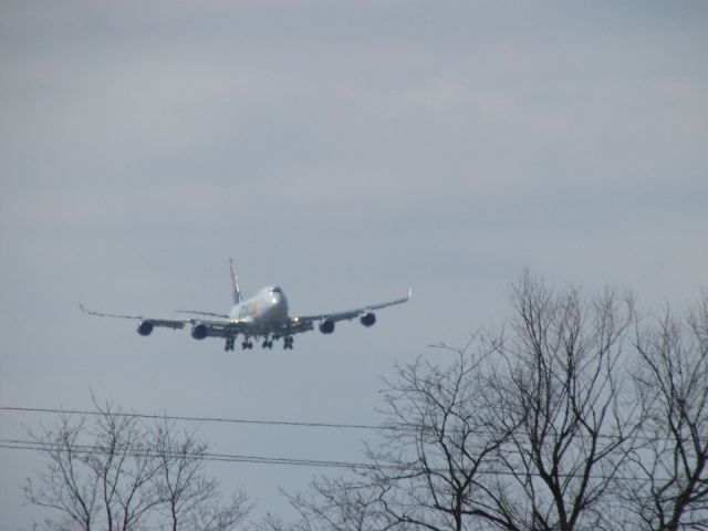 Boeing 747-400 (N415MC) - Taken from viewing parking lot at KCVG on 03/23/2014. br /Atlas Air 747-400 coming in on 36R