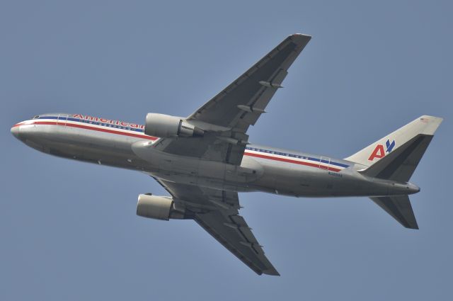 BOEING 767-200 (N329AA) - Departing 13R. Taken from Inwood Park.