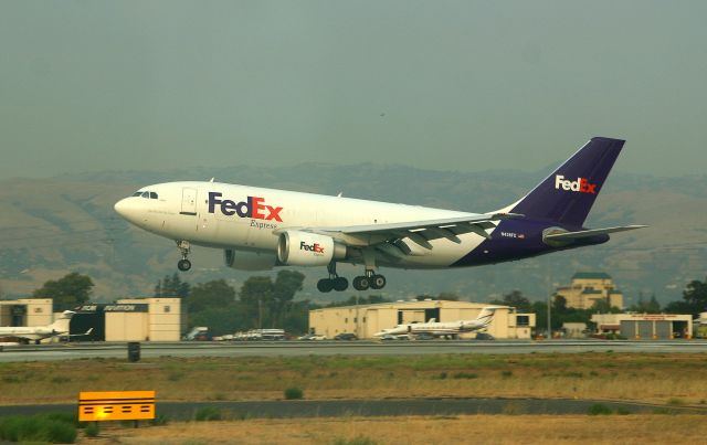 Airbus A310 (N436FE) - KSJC - 9/6/2007 - waiting at the hold bars on Runway 29 at San Jose, this A310 landing about 525pm on this smoky/hazy day - the "Morgan Hill Fire" was in full swing south of San Jose and ruined the sky on my only day to fly with others. Click full for wide view.