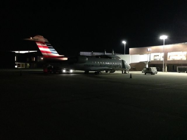 Canadair Regional Jet CRJ-200 (N226JS) - N226JS sits at gate B1 at Newport News/Williamsburg International Airport (KPHF) preparing to operate as Blue Streak 5303 to Charlotte/Douglas International (KCLT) April 4, 2015. Wearing the new American Eagle Livery. Aircraft is a 2004 Canadair Regional Jet CRJ-200.