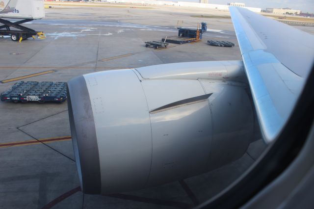 BOEING 767-300 — - On November 29, 2012, American 1167 heavy, a Boeing 767-323ER, departed from MIA at   0945 bound for POS, right on schedule. It was "smooth flying" until we got over the   Bahamas... At around 34,000 feet, a gentleman on board had a heart attack. We   immediately turned around and started heading back to MIA for an emergency landing.   We climbed to 35,000 feet and once we were over Florida, we began a pretty fast   descent. The pilots pulled the power all the way back, extended the   spoilers/speedbrakes, and pitched down like 5 degrees. In a matter of minutes we   were at less than 3,000 feet and were right next to MIA. We did a close traffic   pattern to runway 9, which is like the first time Ive ever seen a widebody jet do   one that small. Our approach was high and fast, and we landed hard and fast. Then we   taxied off the runway, bla bla bla, dropped off the guy (who was feeling a little   better), then we took off again. The crew really handled the emergency nicely. 3.3   hours later, we landed at POS in Trinidad. More info here: (a rel=nofollow href=http://flightaware.com/live/flight/AAL1167/history/20121129/1445Z/KMIA/TTPPhttp://flightaware.com/live/flight/AAL1167/history/20121129/1445Z/KMIA/TTPP/a). This picture is of the massive GE CF6 engine mounted on the starboard wing taken from seat 13J at the gate, before we departed.